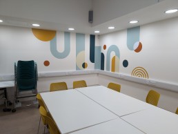 Cut vinyl shapes on wall